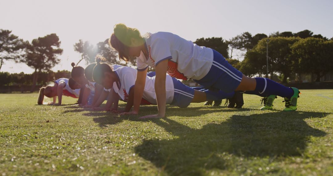 Female Soccer Team Performing Push-Ups During Training Session - Free Images, Stock Photos and Pictures on Pikwizard.com