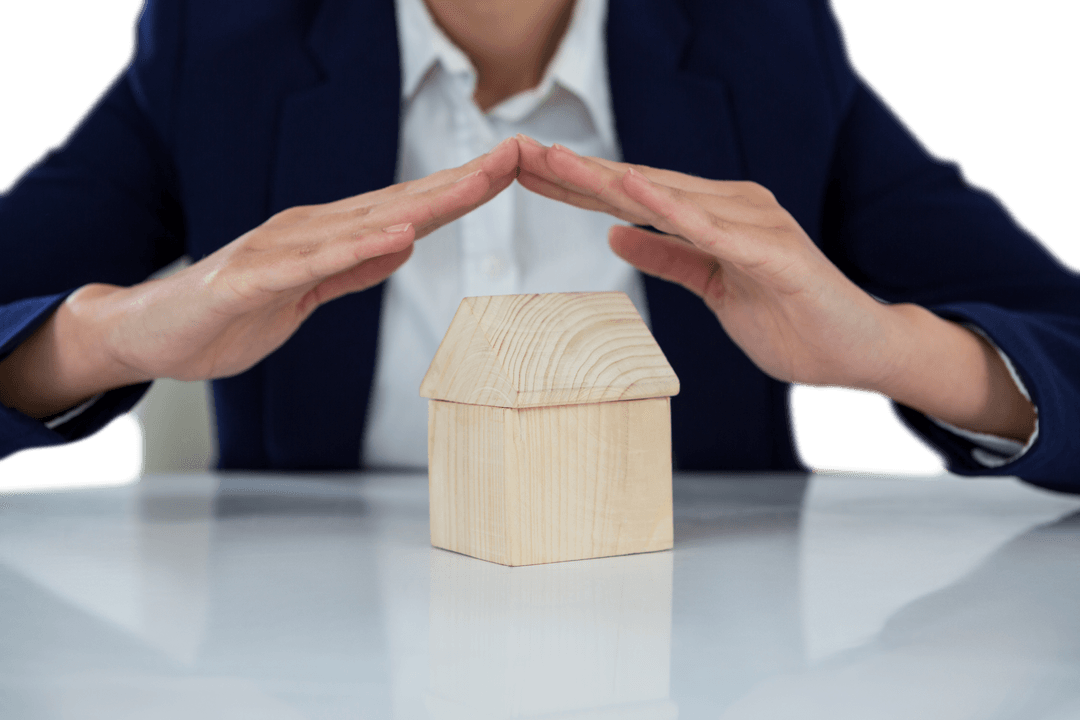 Transparent Hands Over Wooden House Symbolizing Insurance