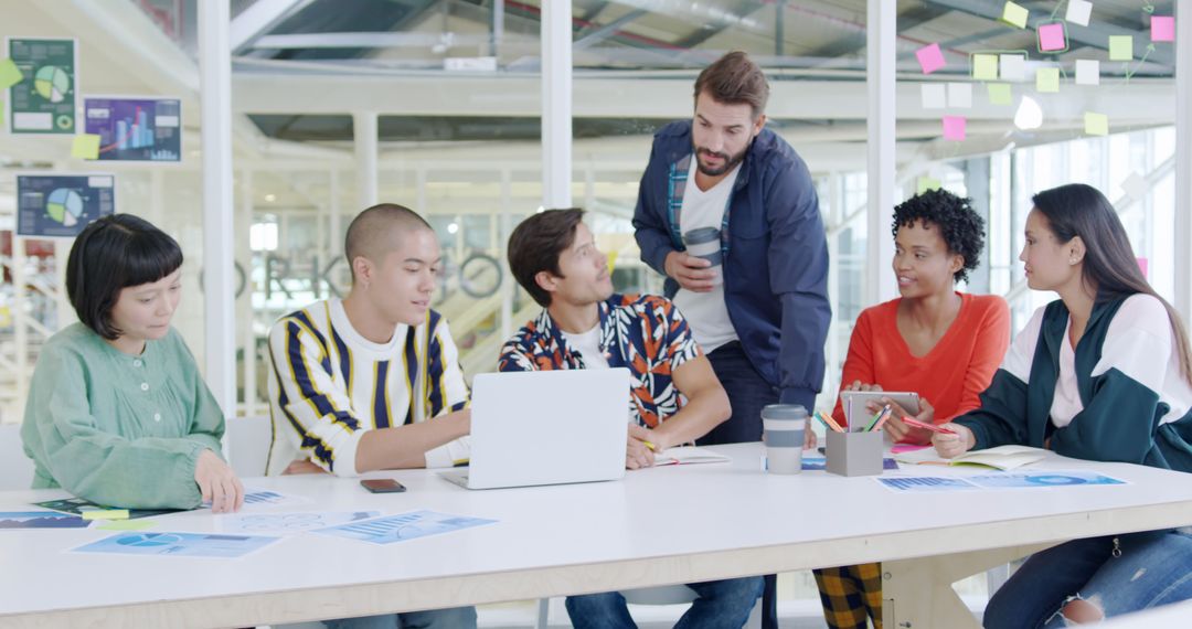 Diverse Team Collaborating in Bright Office Environment