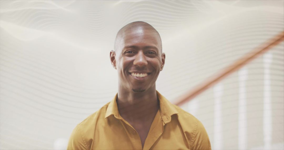 Smiling Professional Man in Modern Office Environment