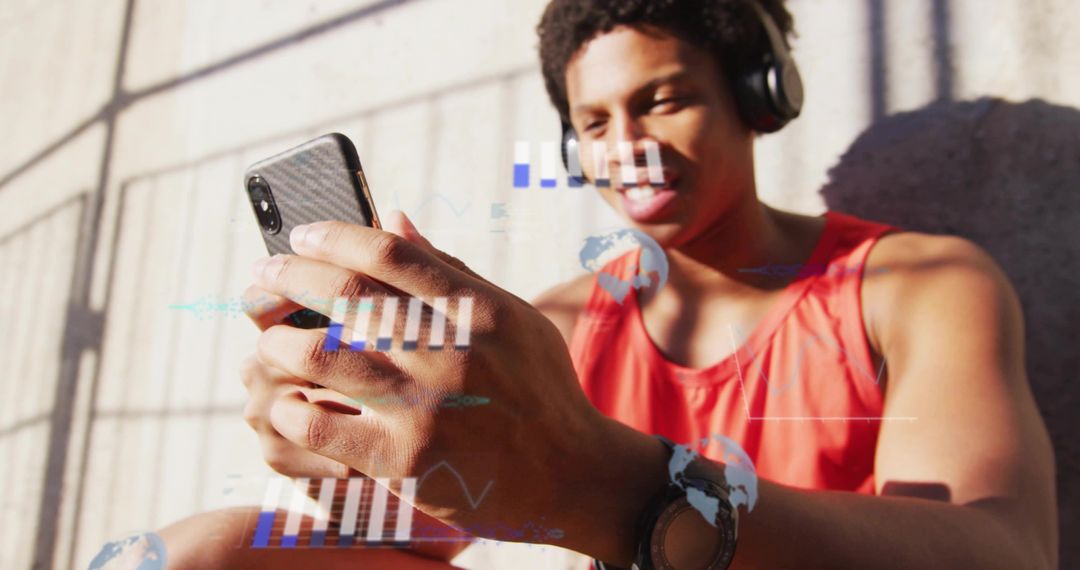 Urban Male Checking Data on Smartphone with Headphones