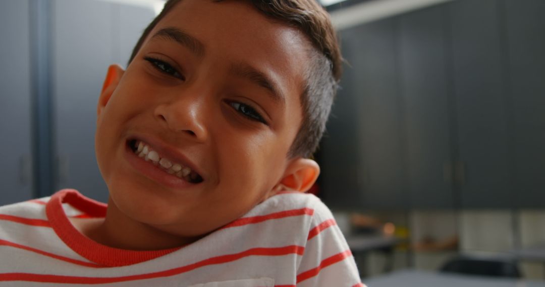 Happy Schoolboy Smiling in Classroom Environment