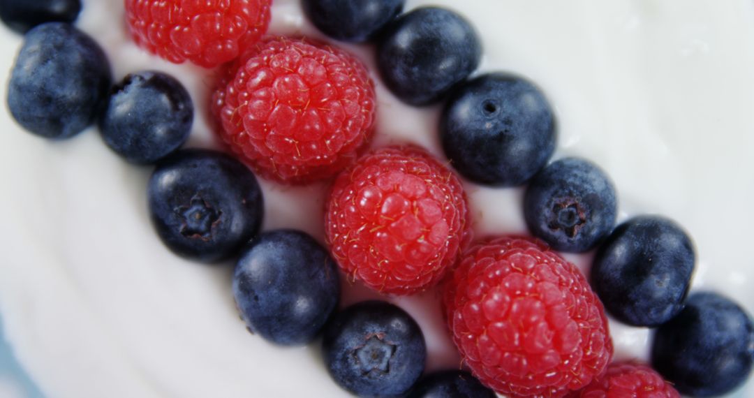 Fresh Blueberries and Raspberries on White Yogurt - Free Images, Stock Photos and Pictures on Pikwizard.com