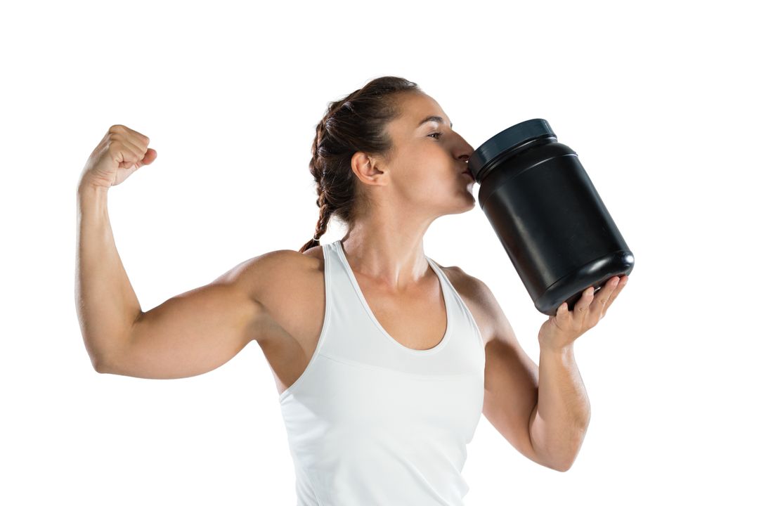 Female athlete flexing muscles while kissing supplement jar - Free Images, Stock Photos and Pictures on Pikwizard.com
