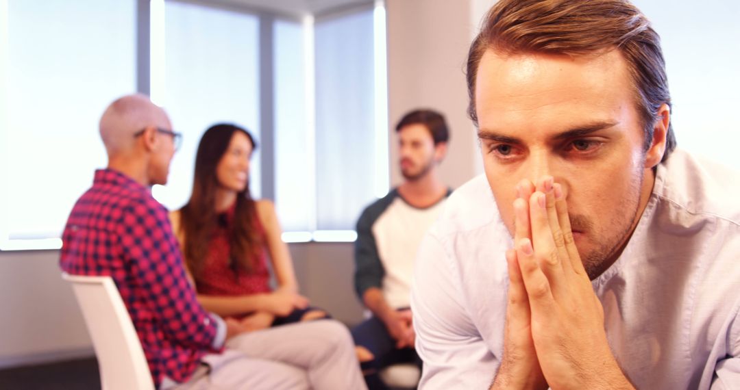 Anxious Man in Supportive Group Setting