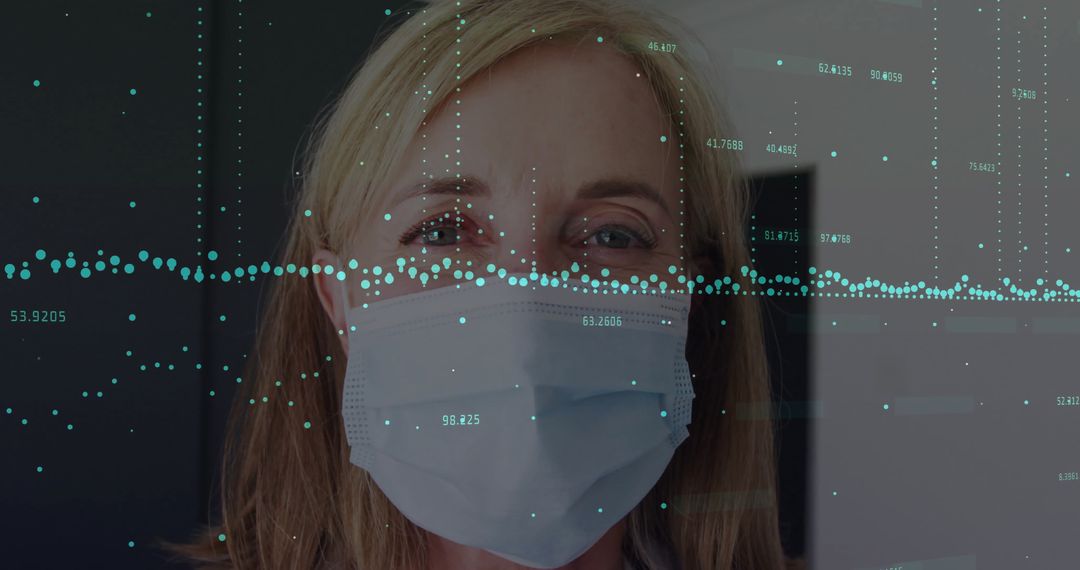 Woman in Mask Monitored by Digital Interface in Medical Setting