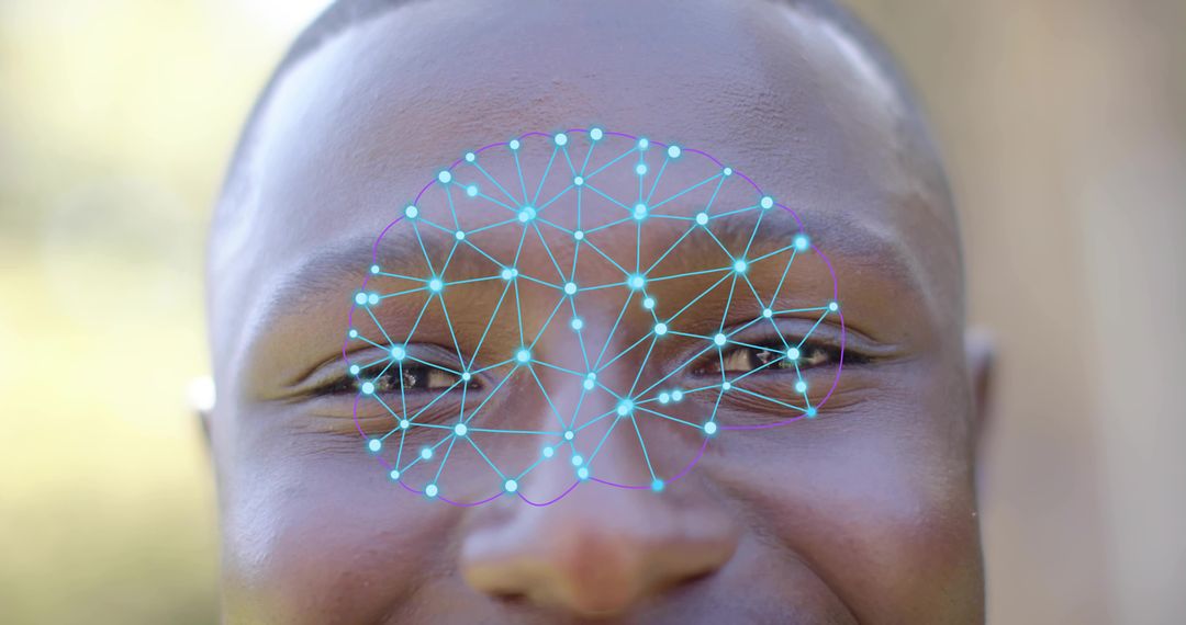 Smiling man with facial recognition hologram overlay showing biometric network across face