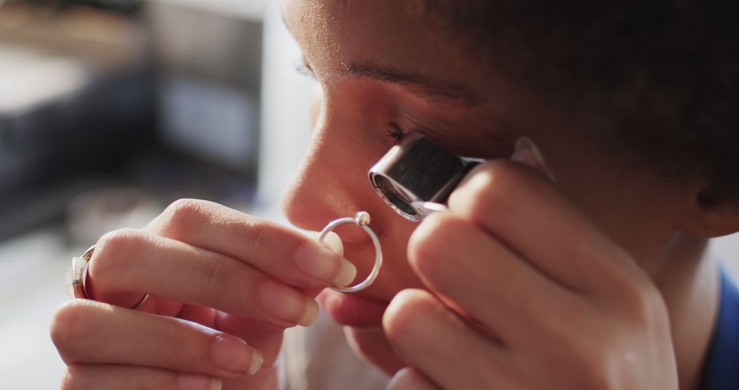 Detailed Jeweler Examining Diamond Ring with Magnifying Loupe - Free Images, Stock Photos and Pictures on Pikwizard.com