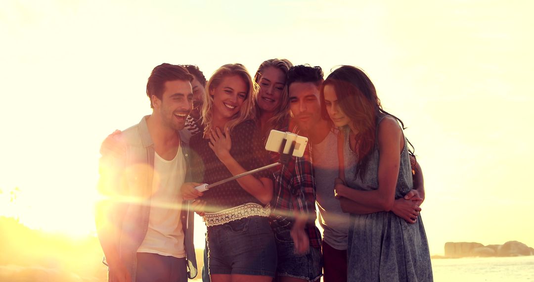 Group of Friends Taking Selfie on the Beach During Sunset - Free Images, Stock Photos and Pictures on Pikwizard.com