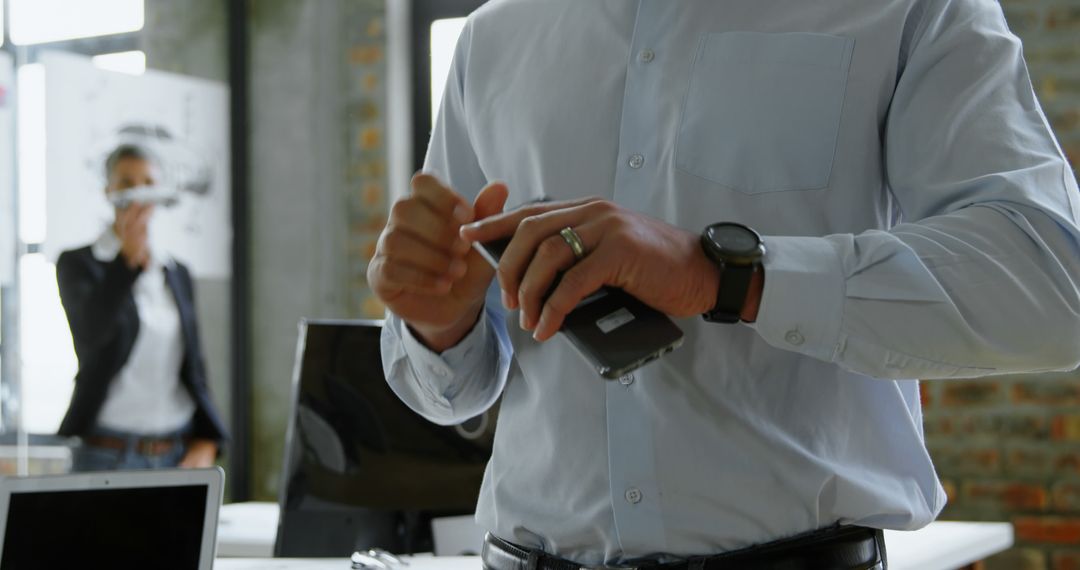 Businessman Using Modern Technology in Startup Office - Free Images, Stock Photos and Pictures on Pikwizard.com