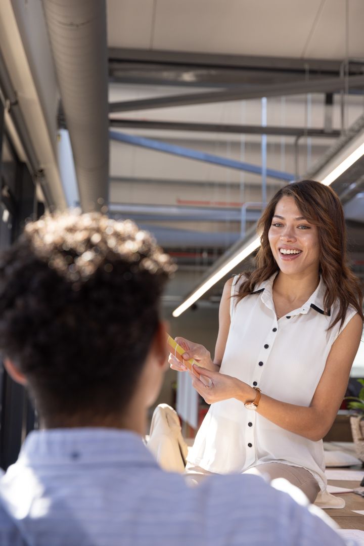 Coworkers Collaborate on Project in Modern Office Space