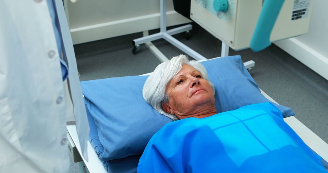 Elderly Woman Lying in Hospital Bed Undergoing Medical Examination - Free Images, Stock Photos and Pictures on Pikwizard.com