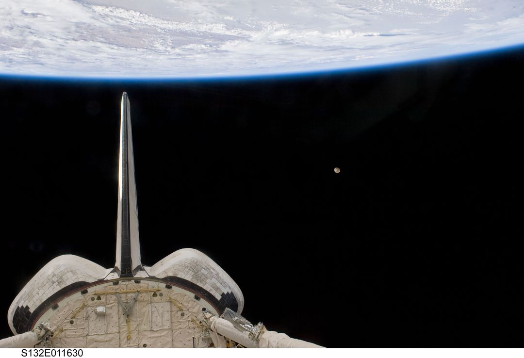 Space Shuttle Atlantis, Earth's Horizon, and Moon from Orbit - Free Images, Stock Photos and Pictures on Pikwizard.com