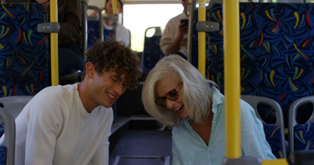 Happy Senior Woman and Young Man Riding Public Bus - Free Images, Stock Photos and Pictures on Pikwizard.com