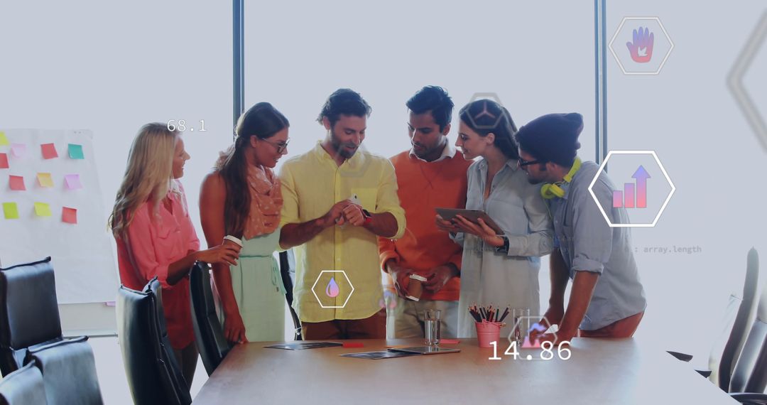 Diverse Team Brainstorming Around Conference Table with Technology Tools