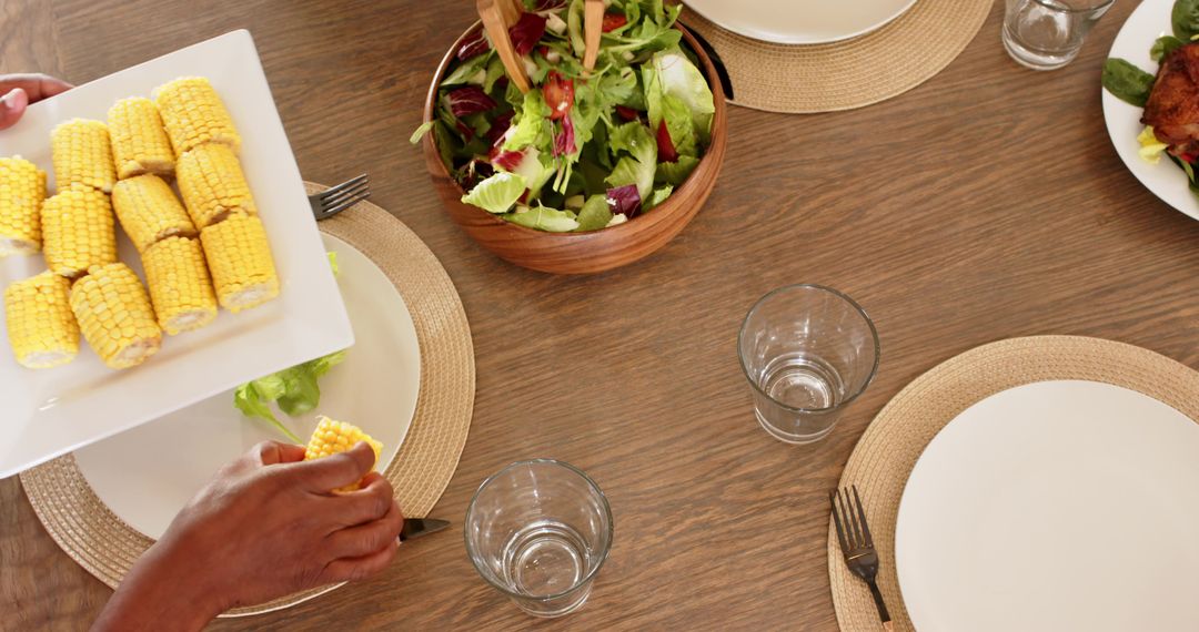 Plates of Color: Enjoying Corn and Salad Around the Dinner Table