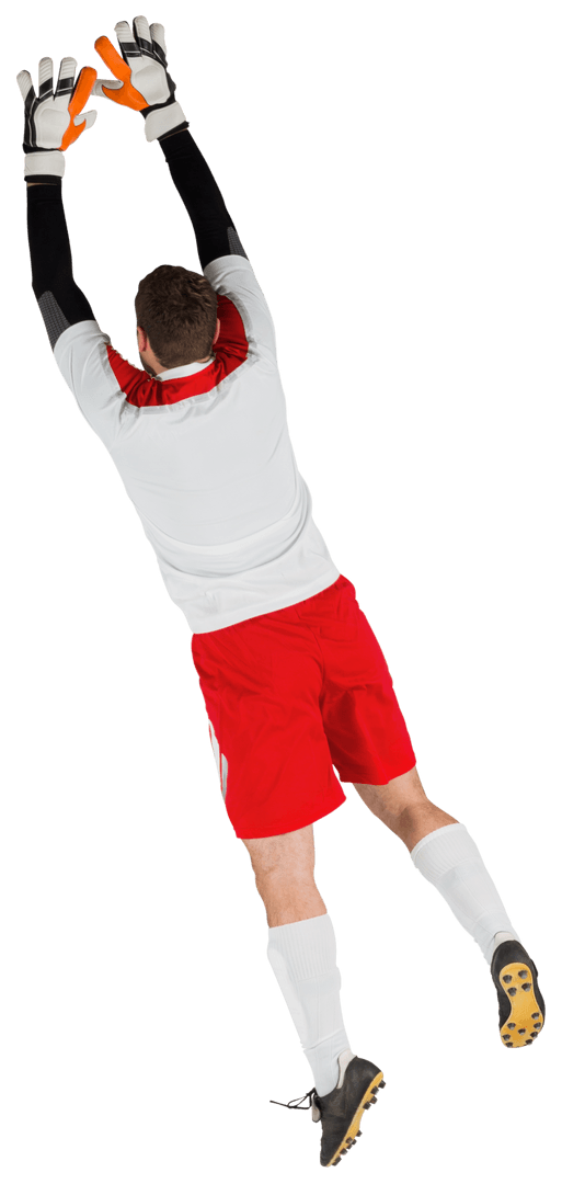 Goalkeeper Wearing White Uniform with Red Accent Jumping for Save