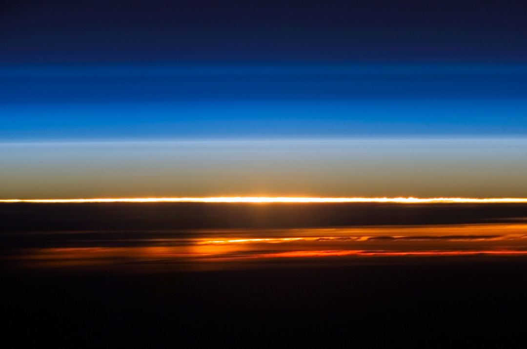 Sunset Above Earth's Atmosphere Viewed from ISS - Free Images, Stock Photos and Pictures on Pikwizard.com