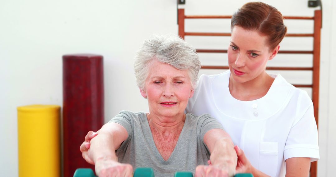 Senior Woman Receiving Physical Therapy with Professional Therapist - Free Images, Stock Photos and Pictures on Pikwizard.com