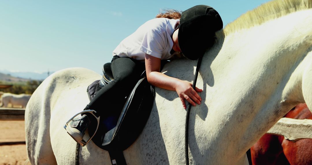 Young Girl Hugging Horse While Sitting in Saddle at Ranch - Free Images, Stock Photos and Pictures on Pikwizard.com