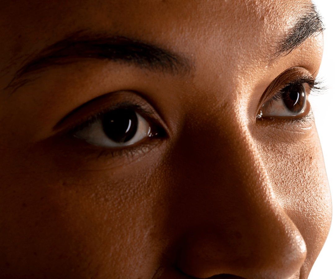 Close-Up of Businesswoman's Transparent Eyes Against White Background