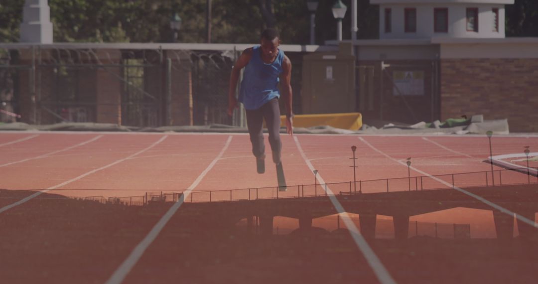 Determined Disabled Runner on Track Reflecting Perseverance