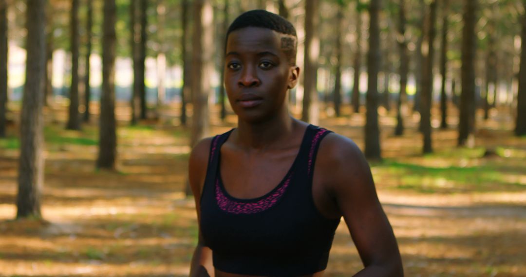 Young woman jogging in forest, staying fit and healthy - Free Images, Stock Photos and Pictures on Pikwizard.com