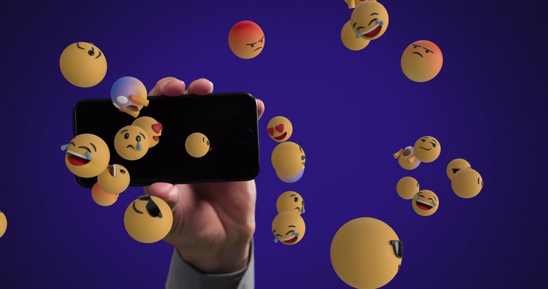 Hand Holding Smartphone with Diverse Floating Emojis