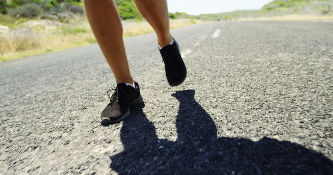 Close-up of Legs Running on Open Road - Free Images, Stock Photos and Pictures on Pikwizard.com