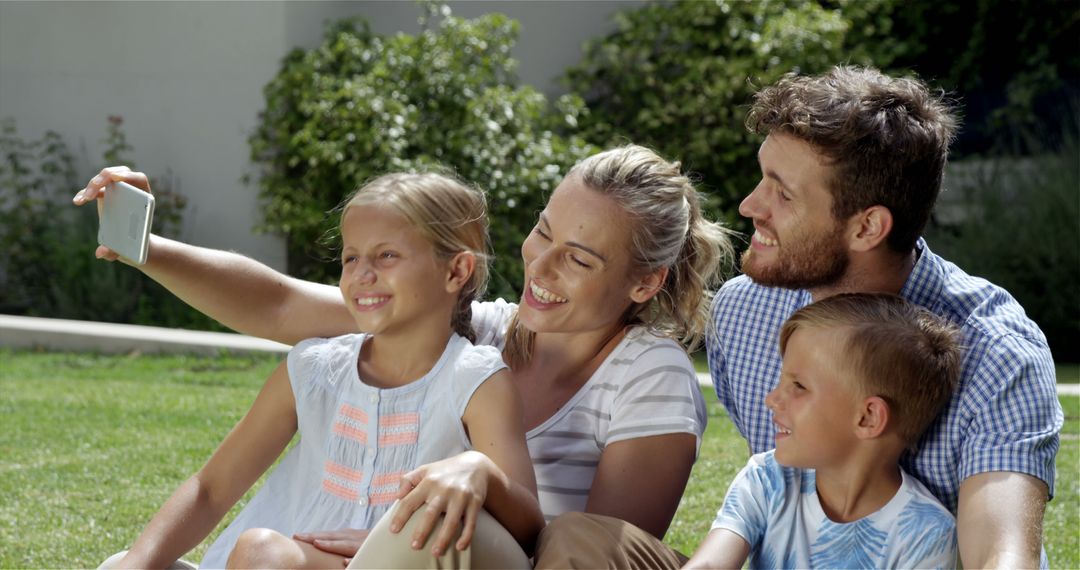 Happy family taking selfie on sunny day in backyard - Free Images, Stock Photos and Pictures on Pikwizard.com