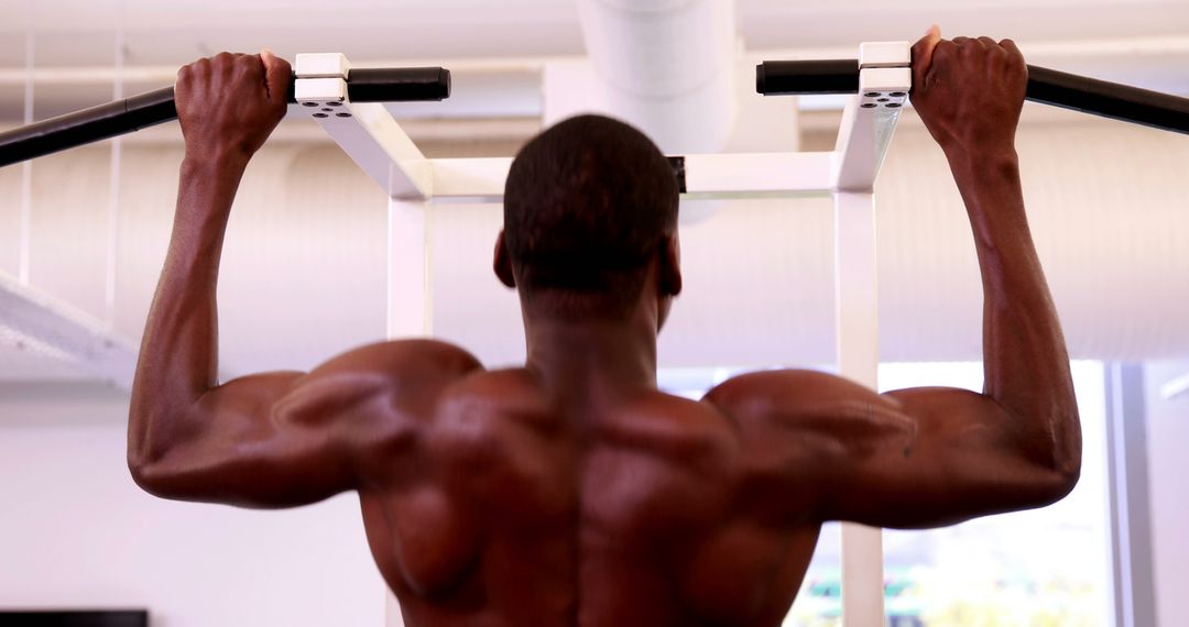 Muscular Man Doing Pull-Ups in Gym - Free Images, Stock Photos and Pictures on Pikwizard.com