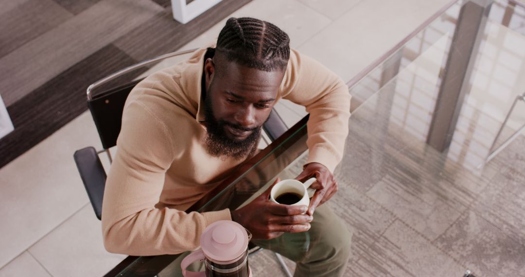 Businessman Enjoying Coffee Break at Office Desk