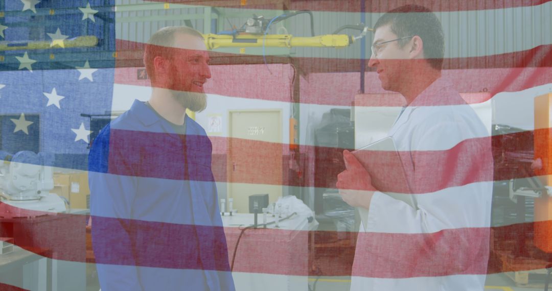 American Flag Overlaying Workers Discussing in Factory