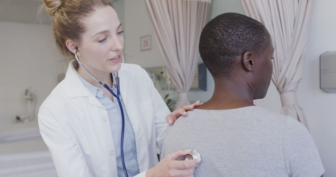 Female Doctor Checking Patient with Stethoscope in Medical Clinic - Free Images, Stock Photos and Pictures on Pikwizard.com