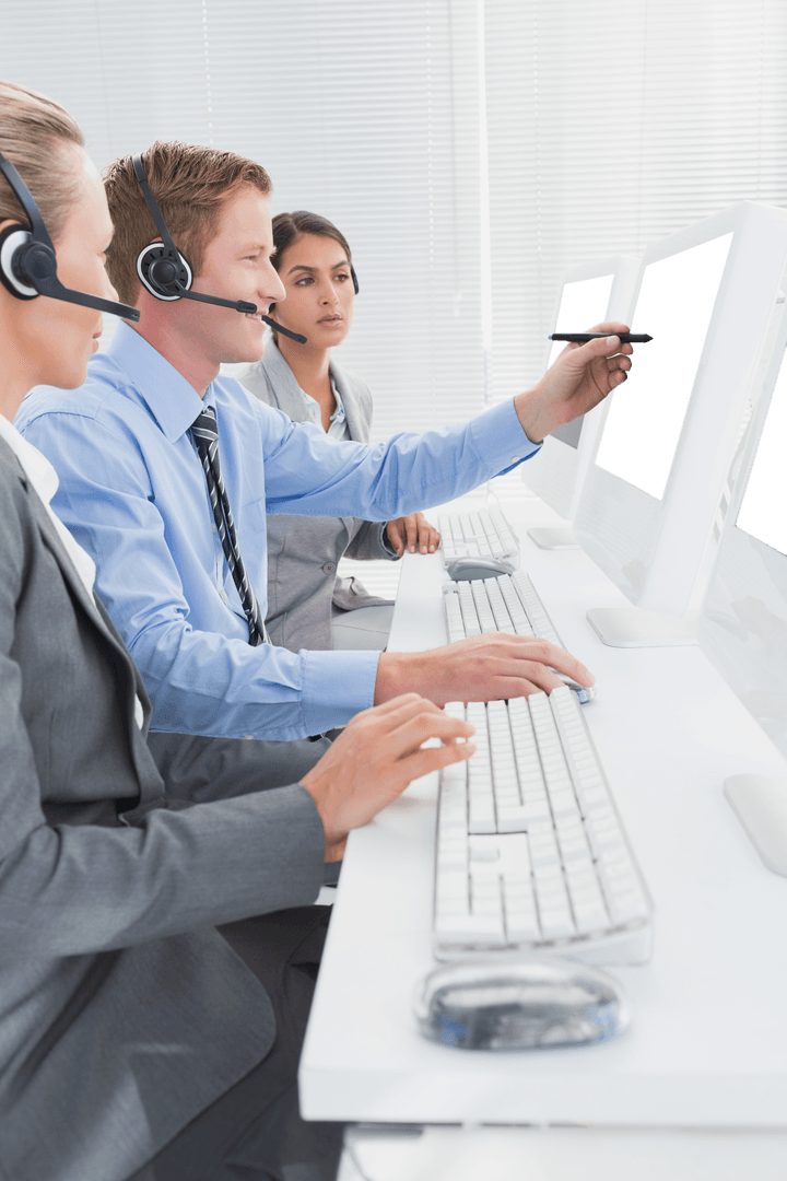 Transparent Business Team Collaborating at Computers