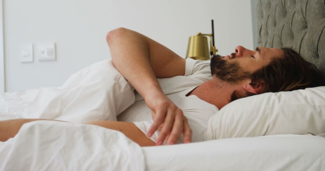 Man Relaxing in Bed with Eyes Closed, Peaceful Rest Concept - Free Images, Stock Photos and Pictures on Pikwizard.com