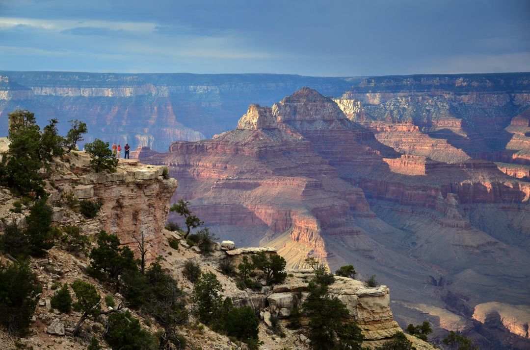 Tourists Enjoying Scenic View of Grand Canyon at Sunset - Free Images, Stock Photos and Pictures on Pikwizard.com