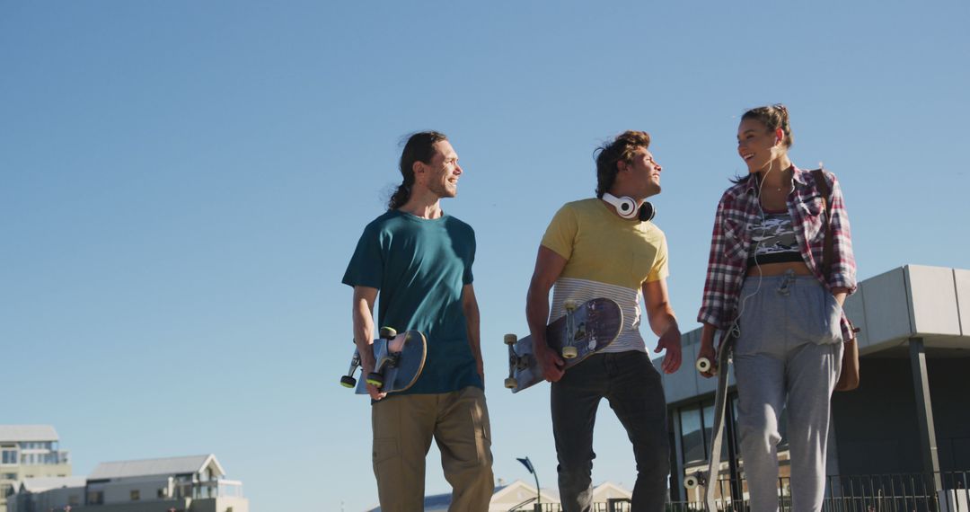 Three Friends Skateboarding Outdoors in the Sun - Free Images, Stock Photos and Pictures on Pikwizard.com