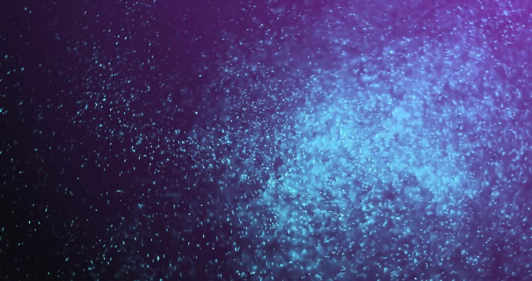 Glowing Particles on Purple Background Creating Mystical Haze