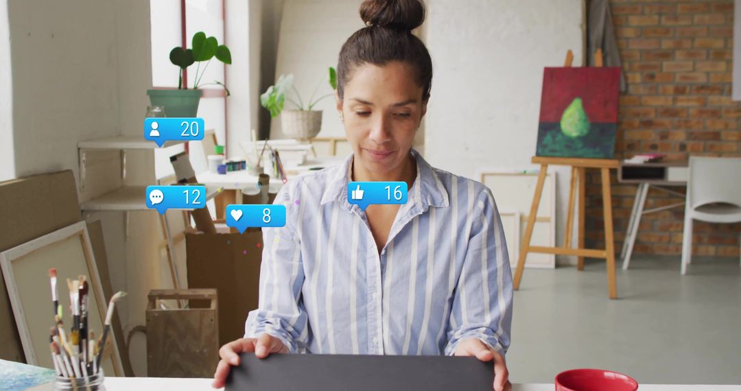 Woman Engaging with Social Media in Artistic Studio Environment