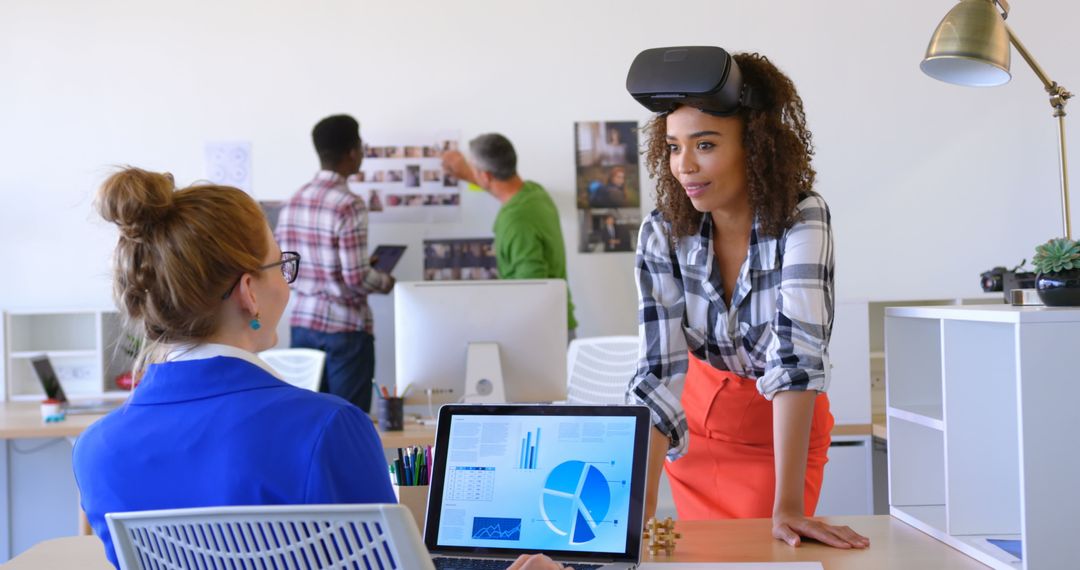 Diverse Team Collaborating on VR Project in Modern Office