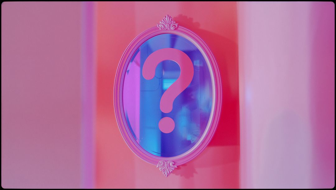 Ornate Oval Mirror with Pink Question Mark on Colored Wall