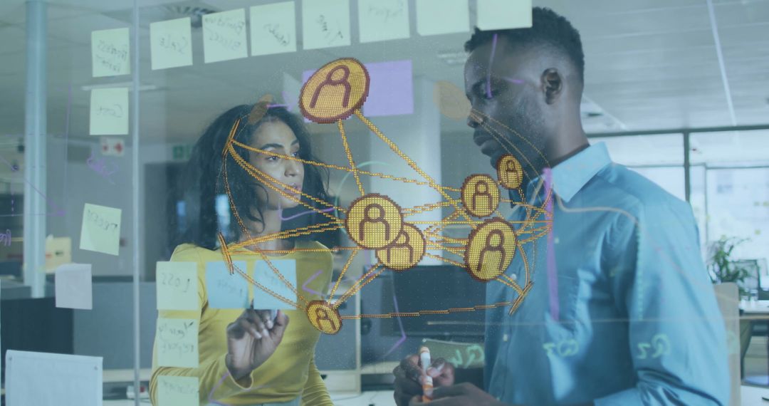 Professionals Sketching Network Connections in Modern Office