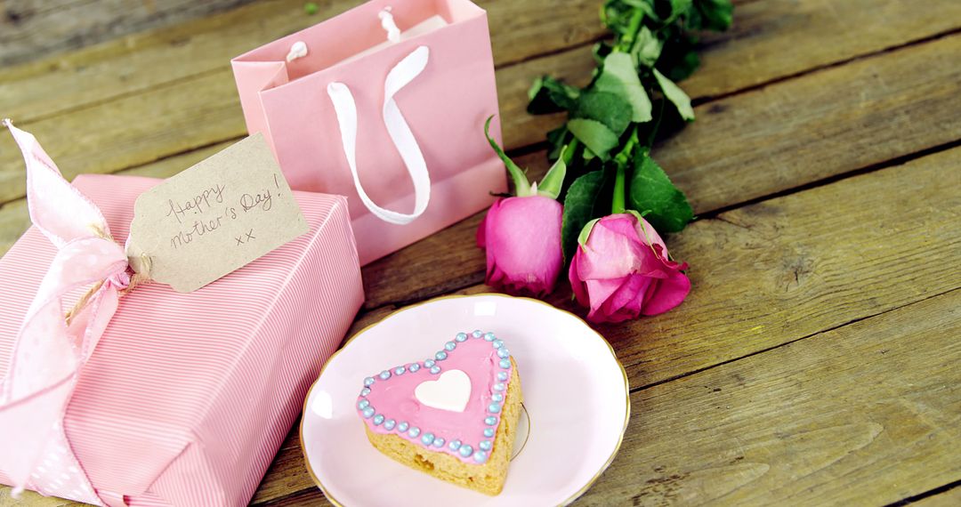 The setup embodies Valentine's Day romance with cookies, roses, and a heartfelt gift. - Free Images, Stock Photos and Pictures on Pikwizard.com