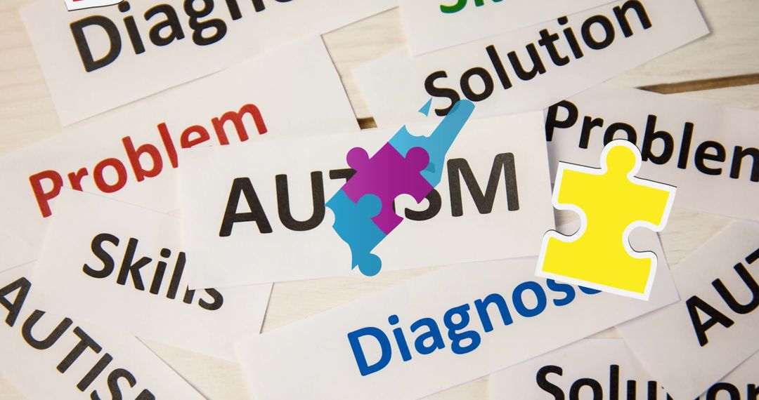 Autism Concept with Puzzle Pieces and Diagnostic Words