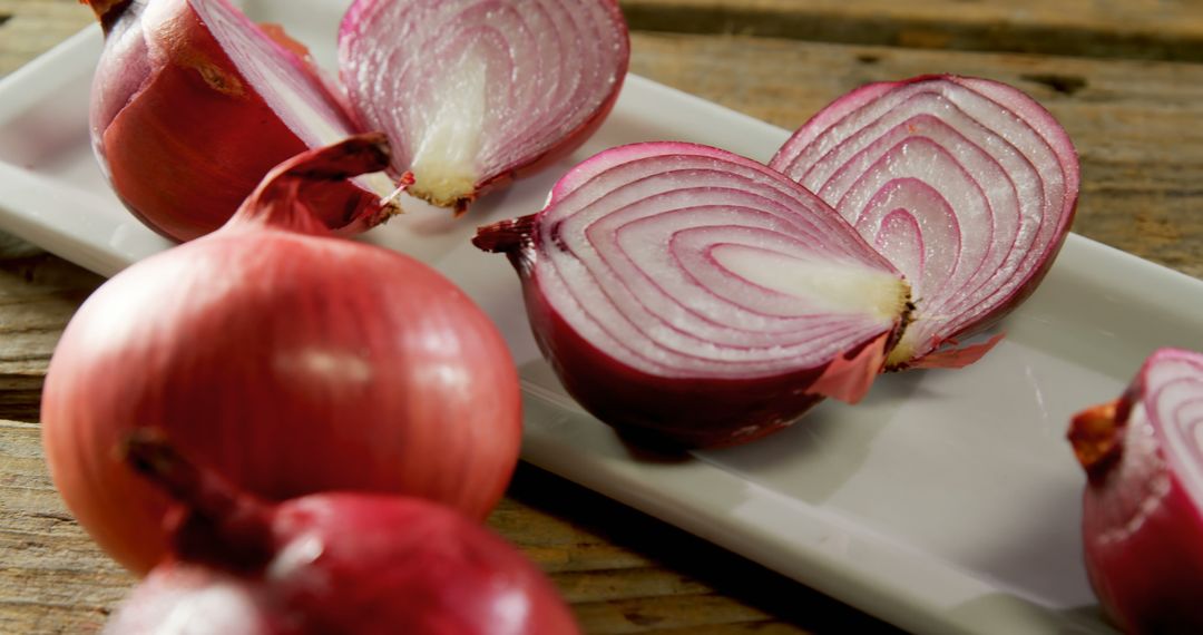 Freshly Sliced Red Onions on Wooden Table - Free Images, Stock Photos and Pictures on Pikwizard.com