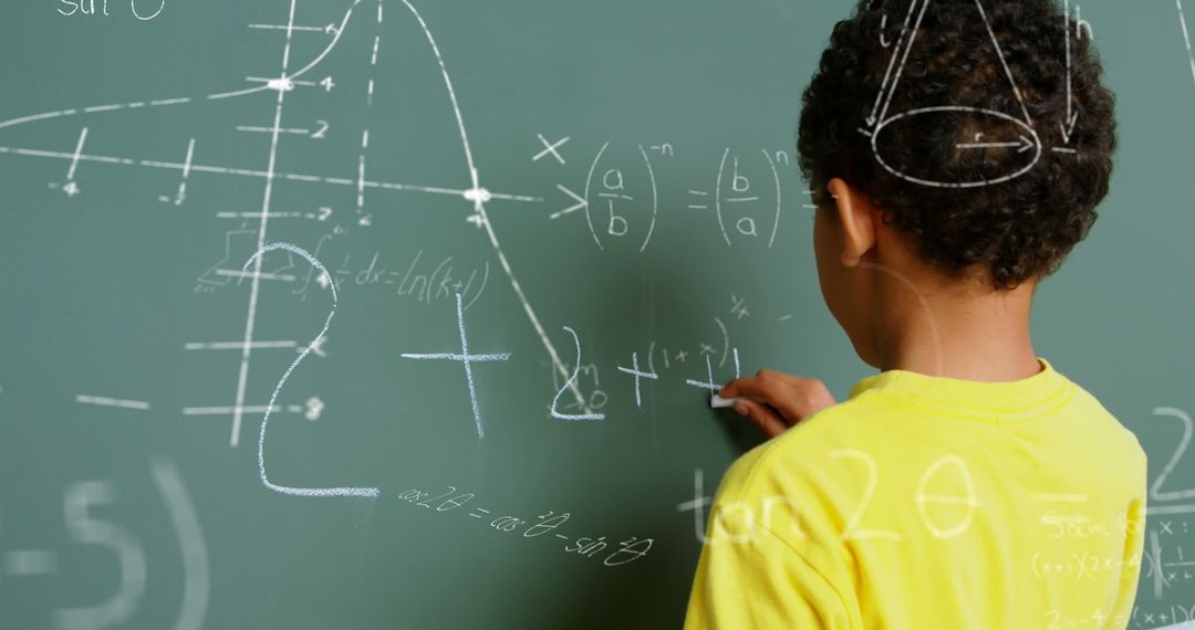 Young Student Writing Math Equations on Chalkboard