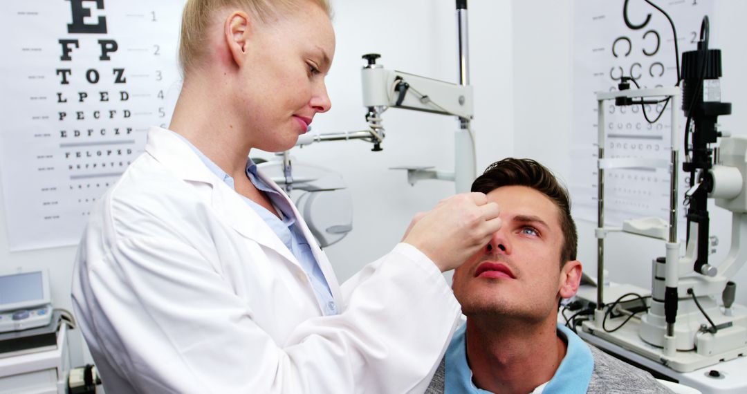 Optometrist Applying Eye Drops in Clinic - Free Images, Stock Photos and Pictures on Pikwizard.com