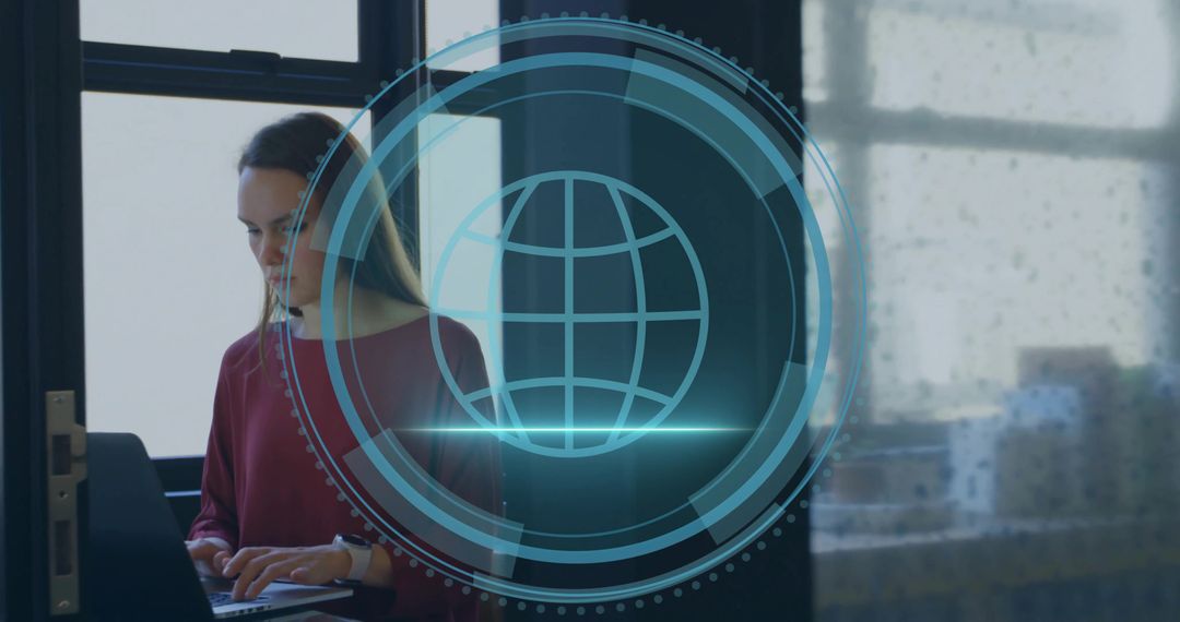 Woman in Office Using Laptop with Holographic Globe Overlay