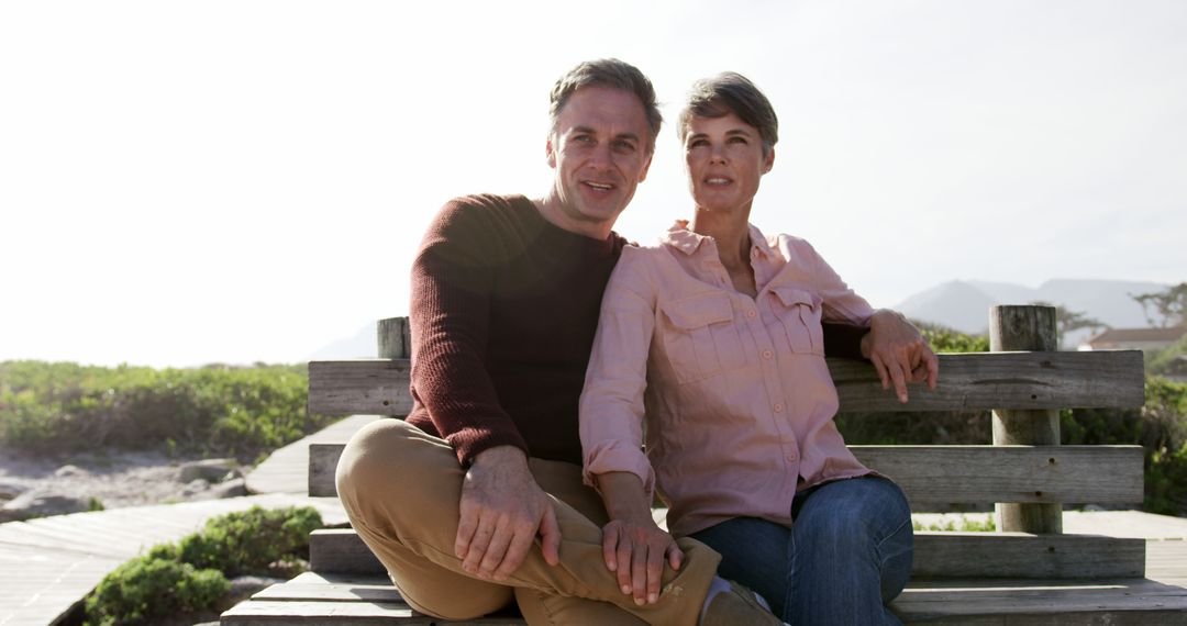 Mature Couple Relaxing on Bench by the Ocean - Free Images, Stock Photos and Pictures on Pikwizard.com